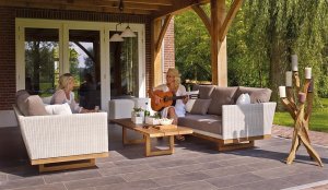 Two women on backyard patio with outdoor tile