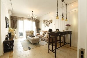 Living room with tile floor and sliding glass door to exterior