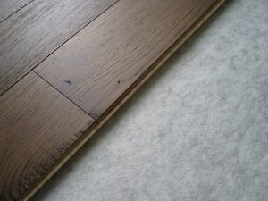 Engineered hardwood and vinyl plank are affordable, low-maintenance alternatives to solid hardwood.